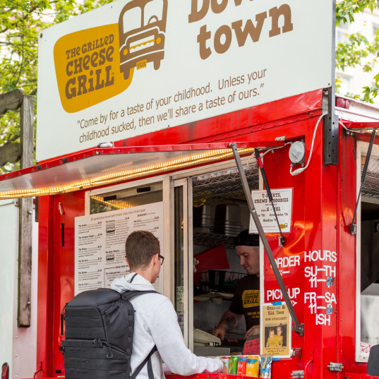 L&C student eating at a food cart in downtown Portland.