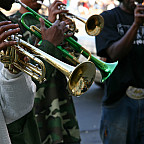 Close up of a person playing a trumpet.